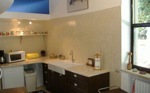 Villa Ettore: Countertop, Interior Design, Cabinetry, Flooring, Kitchen, Light Fixture, Lighting, Ceiling, Furniture, Floor