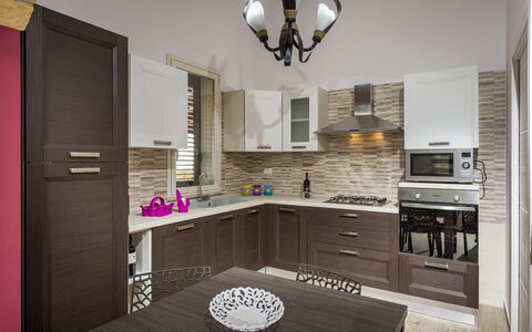 Villa Gea: Kitchen, Furniture, Countertop, Cabinetry, Kitchen Appliance, Major Appliance, Interior Design, Wood, Cupboard, Flooring
