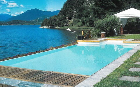 Villa Isa: Blue, Water, Swimming Pool, Resort, Composite Material, Leisure, Eco Hotel, Shade, Water Feature, Outdoor Furniture