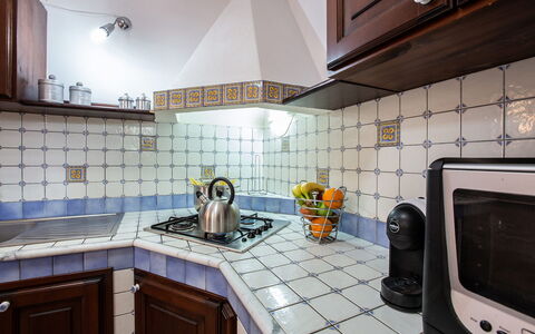 Villa Isabella: Kitchen, Countertop, Interior Design, Kitchen Appliance, Flooring, Kitchen Stove, Major Appliance, Floor, Tile, Gas Stove