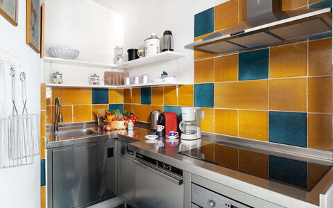 Villa Magnolia: Kitchen, Countertop, Yellow, Kitchen Appliance, Flooring, Interior Design, Floor, Kitchen Sink, Major Appliance, Tile