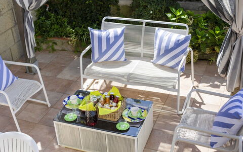 Villa Mouna: Furniture, Outdoor Furniture, Chair, Table, Outdoor Table, Garden, Folding Chair, Patio, Houseplant, Shade