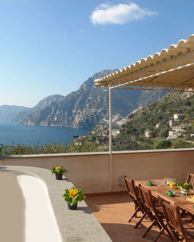 Villa Valeria: Furniture, Table, Chair, Coastal And Oceanic Landforms, Sea, Coast, Outdoor Furniture, Resort, Mountain Range, Kitchen & Dining Room Table