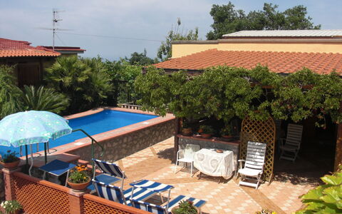 Villa Due Golfi: Swimming Pool, Flowerpot, Resort, Furniture, Eco Hotel, Shade, Outdoor Furniture, Hacienda, Houseplant, Chair