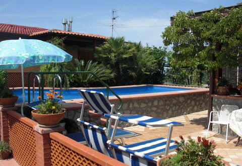 Villa Due Golfi: Furniture, Swimming Pool, Outdoor Furniture, Flowerpot, Resort, Chair, Shade, Eco Hotel, Houseplant, Umbrella