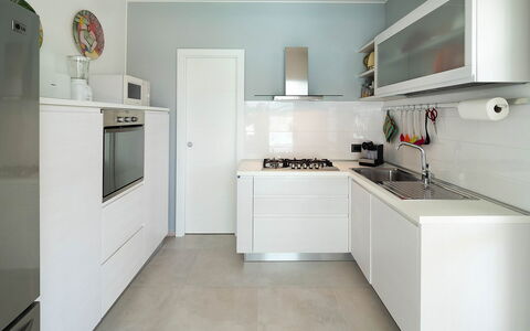 Villa Rossini: Kitchen, Kitchen Appliance, Countertop, Major Appliance, Cabinetry, Interior Design, Flooring, Wood, Kitchen Stove, Home Appliance