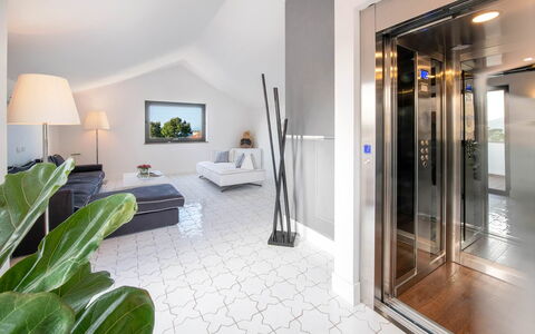 The Ivy Villa: Flooring, Floor, Interior Design, Ceiling, Apartment, Light Fixture, Daylighting, Living Room, Couch