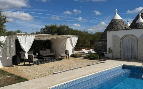 Trulli Maria: Outdoor Furniture, Flagstone, Shade, Chair, Landscaping, Swimming Pool, Outdoor Structure, Yard, Backyard, Patio