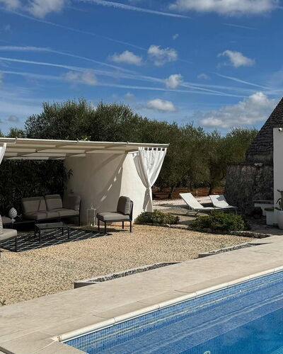 Trulli Maria: Outdoor Furniture, Flagstone, Shade, Chair, Landscaping, Swimming Pool, Outdoor Structure, Yard, Backyard, Patio