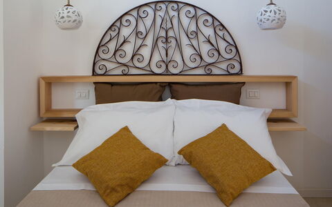 Villa Salentina: Bed, Bedding, Bedroom, Furniture, Bed Sheet, Interior Design, Wood, Linens, Textile, Throw Pillow