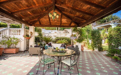 Villa Martina: Flooring, Floor, Furniture, Garden, Resort, Flowerpot, Chair, Outdoor Structure, Porch, Patio