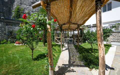 Villa Marina Grande: Garden, Outdoor Structure, Shade, Backyard, Yard, Chair, Landscaping, Flagstone, Courtyard, Design