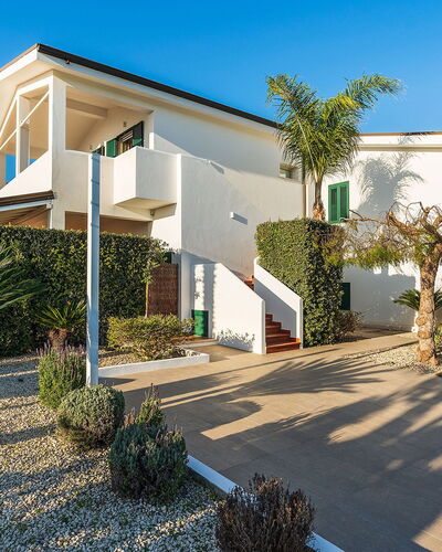 Ninfa: Building, Residential Area, House, Home, Architecture, Facade, Shrub, Roof, Estate
