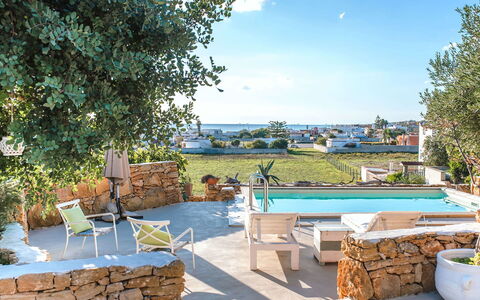 Villa la Rezza: Furniture, Outdoor Furniture, Chair, Shade, Flowerpot, Resort, Houseplant, Swimming Pool, Villa, Sunlounger