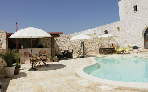 Masseria San Michele: Outdoor Furniture, Flagstone, Swimming Pool, Stone Wall, Umbrella, Resort, Shade, Chair, Concrete, Patio