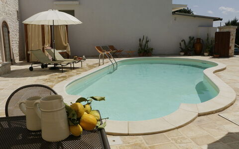 Masseria San Michele: Swimming Pool, Outdoor Furniture, Composite Material, Resort, Umbrella, Chair, Concrete, Flagstone, Shade, Sunlounger