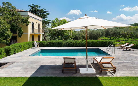 Villa Alcantara: Swimming Pool, Umbrella, Outdoor Furniture, Resort, Furniture, Shade, Garden, Chair, Lawn, Estate