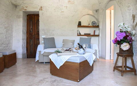 Trulli Martina: Furniture, Wall, Flooring, Interior Design, Floor, Room, Chair, Table, Living Room, Couch