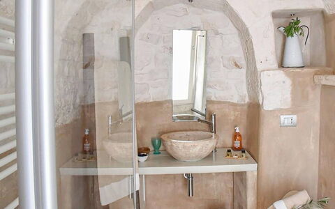 Trulli Martina: Wall, Interior Design, Room, Plumbing Fixture, Ceiling, Light Fixture, Sink, Natural Material, Bathroom Sink, Tap