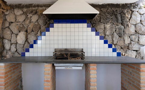 Villa Eva: Tile, Chimney, Brick, Kitchen, Stove, Houseplant, Kitchen Stove