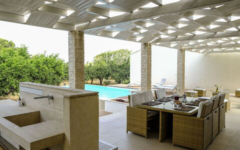 Villa Adriana: Swimming Pool, Flooring, Floor, Architecture, Interior Design, Resort, Shade, Composite Material, Ceiling, Outdoor Furniture