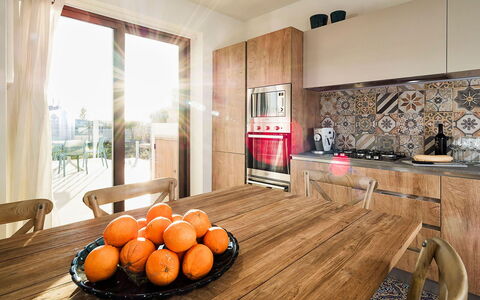 Villa Orietta: Furniture, Kitchen, Countertop, Flooring, Interior Design, Floor, Wood Flooring, Cabinetry, Kitchen Appliance, Wood