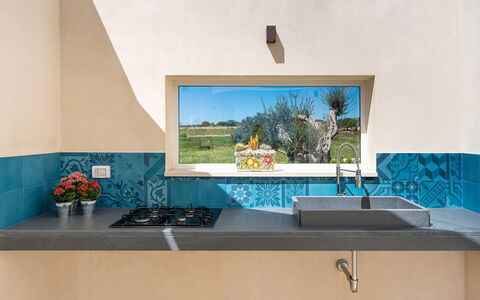 Villa Bruna: Blue, Wall, Kitchen, Countertop, Tile, Paint, Concrete, Natural Material, Houseplant, Wood Stain