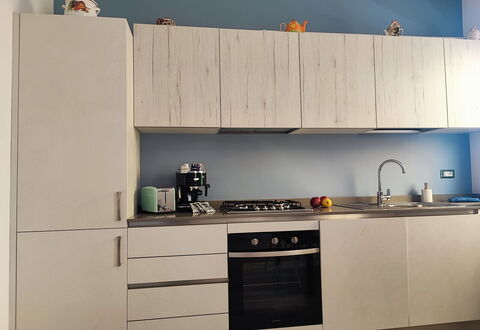 Casa Nadia: Wood, Furniture, Kitchen Appliance, Flooring, Kitchen, Cabinetry, Countertop, Major Appliance, Interior Design, Home Appliance