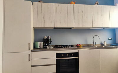 Casa Nadia: Wood, Furniture, Kitchen Appliance, Flooring, Kitchen, Cabinetry, Countertop, Major Appliance, Interior Design, Home Appliance