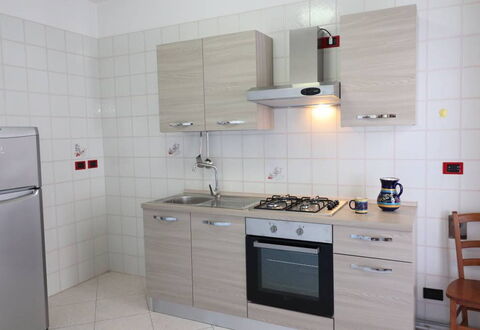 Ludovica: Kitchen, Kitchen Appliance, Major Appliance, Countertop, Kitchen Stove, Flooring, Wood, Kitchen Sink, Stove, Cabinetry