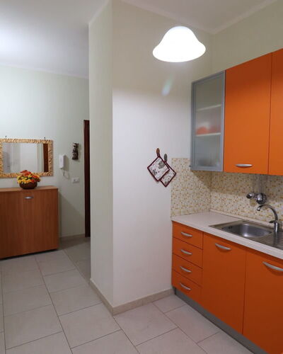 Lucia: Kitchen, Countertop, Flooring, Wood, Kitchen Appliance, Major Appliance, Interior Design, Cabinetry, Floor, Furniture