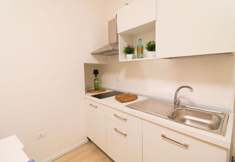 Penelope'S House Centro Storico: Interior Design, Kitchen, Countertop, Wood, Flooring, Kitchen Appliance, Cabinetry, Floor, Major Appliance, Room