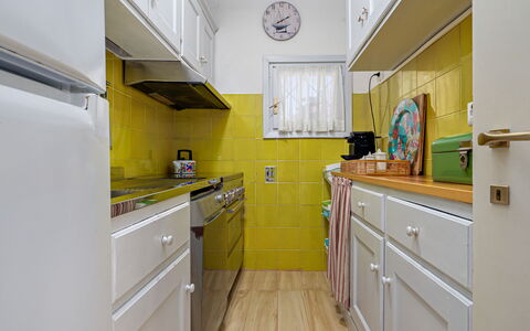 Residenza Rudalza: Kitchen, Kitchen Appliance, Major Appliance, Yellow, Interior Design, Flooring, Countertop, Cabinetry, Floor, Room