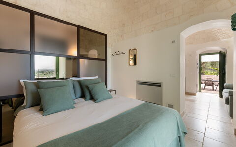 Trullo Miravista Valle D'Itria: Wall, Furniture, Interior Design, Flooring, Ceiling, Lighting, Floor, Bedroom, Bed, Chair