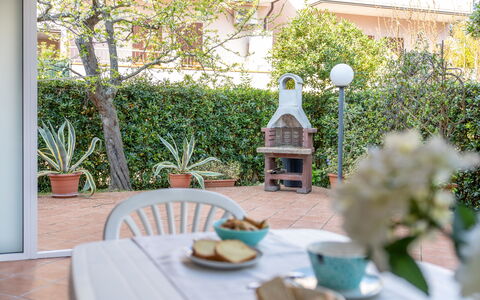 Veranda sul Conero: Furniture, Outdoor Furniture, Chair, Kitchen & Dining Room Table, Outdoor Table, Flowerpot, Garden, Shade, Houseplant, Backyard