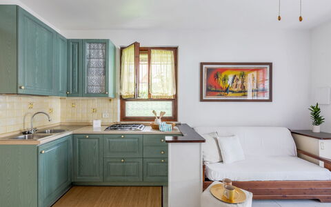 Veranda sul Conero: Furniture, Interior Design, Cabinetry, Flooring, Wood, Kitchen, Countertop, Floor, Kitchen Appliance, Room