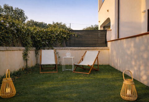 Appartamento Tamara, Budoni: Furniture, Outdoor Furniture, Chair, Garden, Backyard, Shade, Lawn, Wood Stain, Yard, Landscaping