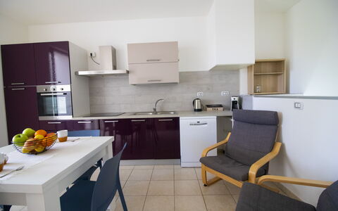 Villa i Gabbiani Otranto: Flooring, Kitchen Appliance, Furniture, Wood, Interior Design, Major Appliance, Kitchen, Countertop, Floor, Cabinetry