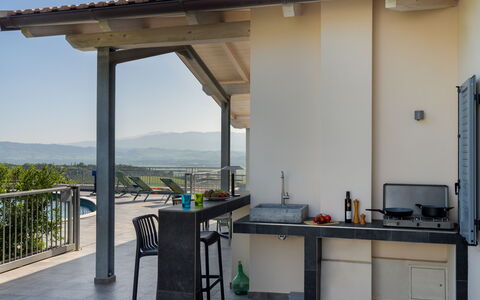 Villa Ombrone: Furniture, Chair, Shade, Outdoor Furniture, Outdoor Structure, Kitchen & Dining Room Table, Kitchen, Countertop, Pergola, Porch