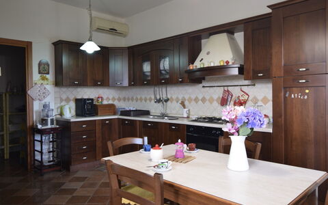 Villa Margi: Furniture, Kitchen, Flooring, Wood, Interior Design, Countertop, Cabinetry, Kitchen Appliance, Floor, Cupboard