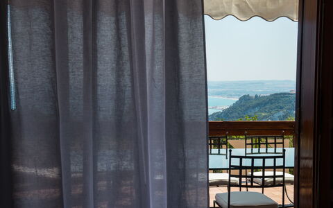 Villa Sole - Exclusive Villa al Conero con Piscina: Window Covering, Textile, Curtain, Window Treatment, Shade, Balcony, Linens, Daylighting