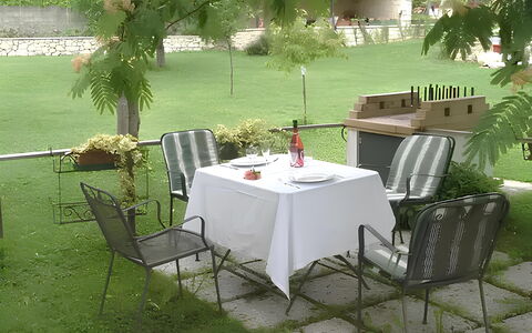 La Corte di Marga - Casa Gustet: Furniture, Chair, Outdoor Furniture, Table, Outdoor Table, Shade, Garden, Umbrella, Backyard, Tablecloth