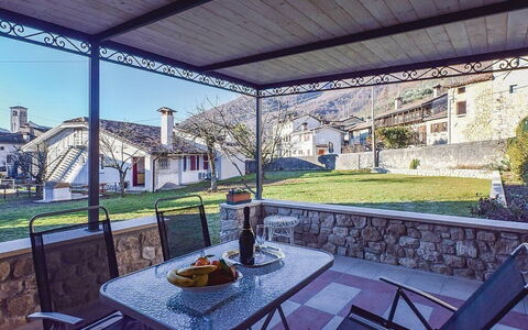 La Corte di Marga - Casa Gustet: Door, Home, Porch, Chair, Shade, Outdoor Furniture, Patio, Houseplant, Outdoor Structure, Flagstone