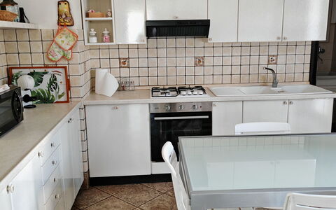 Villa del Monte: Kitchen, Kitchen Appliance, Furniture, Countertop, Flooring, Major Appliance, Cabinetry, Interior Design, Floor, Wood