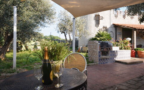Ranch Salomonello: Furniture, Outdoor Furniture, Shade, Chair, Outdoor Table, Garden, Flagstone, Outdoor Structure, Backyard, Courtyard