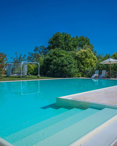 Preseglie Lake Garda: Swimming Pool, Blue, Resort, Composite Material, Leisure, Shade, Eco Hotel, Thermae, Water Feature, Leisure Centre