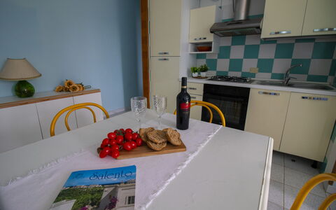 Celeste'S House in Torre Dell'Orso: Furniture, Interior Design, Flooring, Floor, Room, Table, Chair, Tablecloth, Kitchen & Dining Room Table, Kitchen