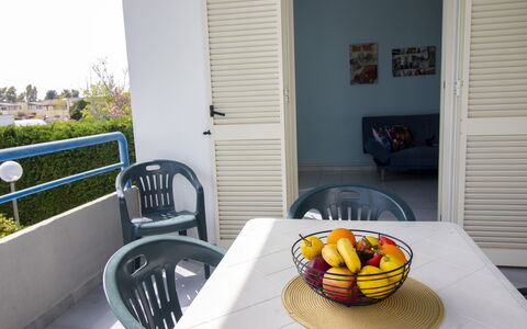 Celeste'S House in Torre Dell'Orso: Furniture, Chair, Outdoor Furniture, Outdoor Table, Shade, Kitchen & Dining Room Table, Coffee Table, Armrest, Balcony, Houseplant