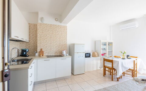 Suite Riviera: Furniture, Interior Design, Flooring, Kitchen, Floor, Kitchen Appliance, Ceiling, Countertop, Major Appliance, Room