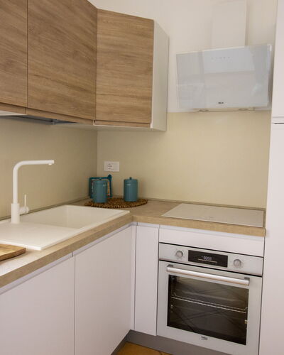 Sweet Dreams Home in Otranto: Kitchen, Countertop, Kitchen Appliance, Cabinetry, Interior Design, Wood, Major Appliance, Flooring, Furniture, Kitchen Sink